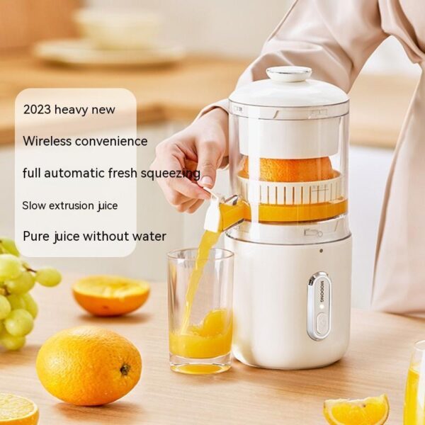 Wireless automatic orange juicer extracting fresh juice into a glass on a modern kitchen counter